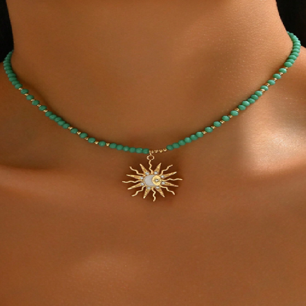 Turquoise beaded necklace with a gold sun pendant on a model