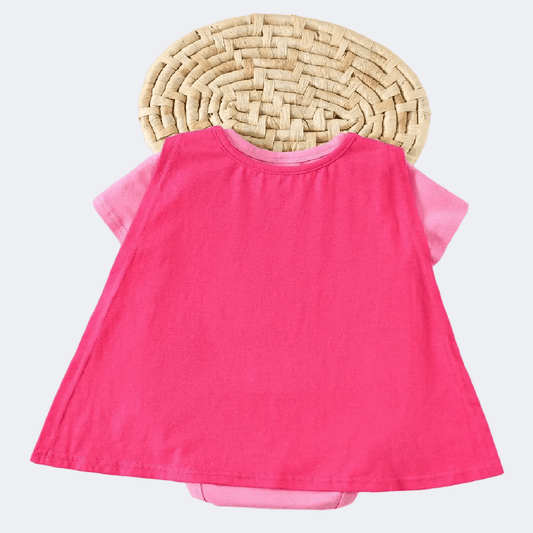 Pink dress with sheer sleeves on a textured white background