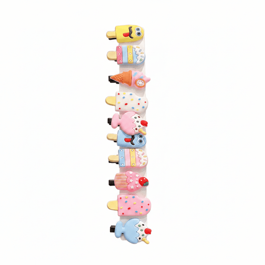 Set of colorful hair clips shaped like ice cream cones, fruits, and other desserts on a white background.