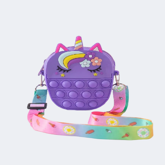 Purple unicorn-shaped pop-it bag with a colorful strap on a pink background
