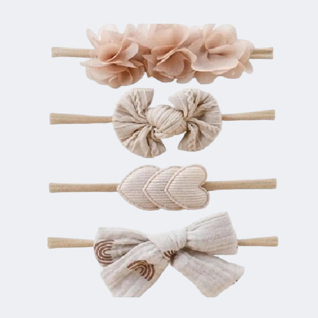 Set of four baby hairbands with floral, knotted, leaf, and bow designs