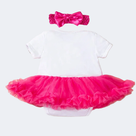 White baby outfit with pink tutu skirt and matching headband on a white background