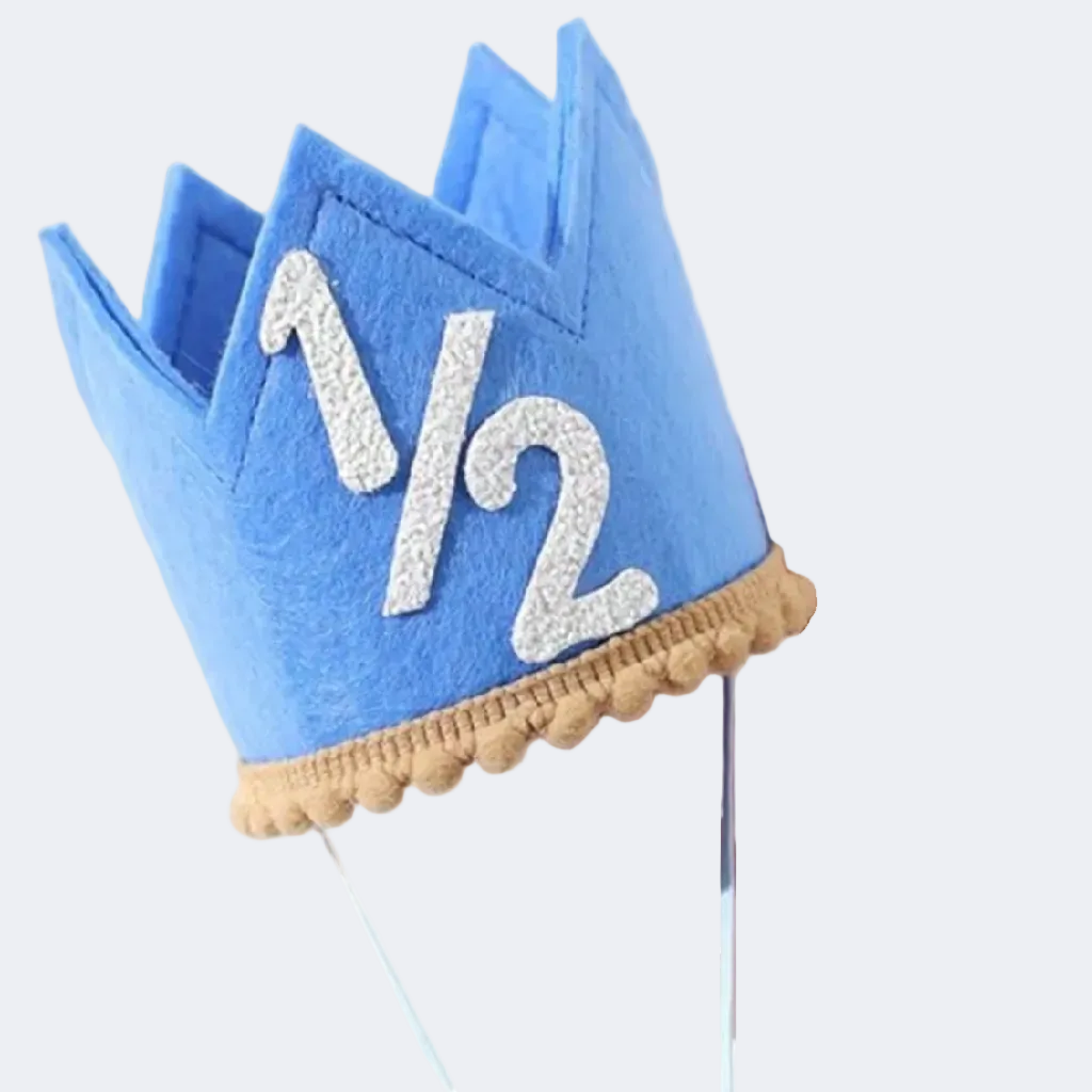 Blue birthday crown with '1/2' on a white background