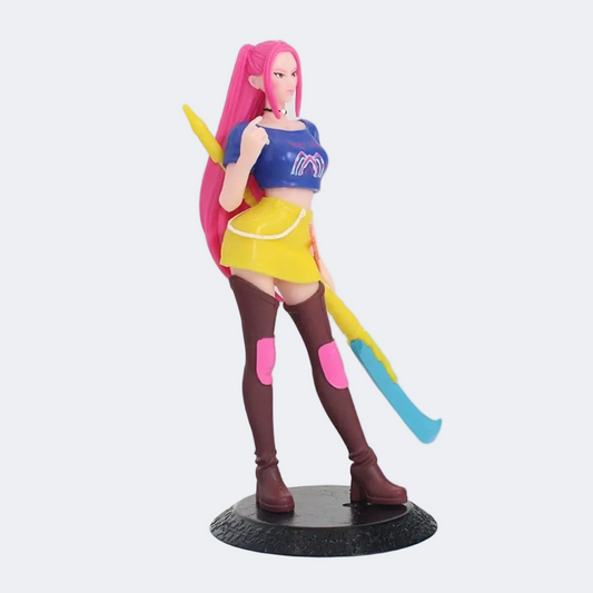 Colorful figurine with pink hair and a blue top on a white background