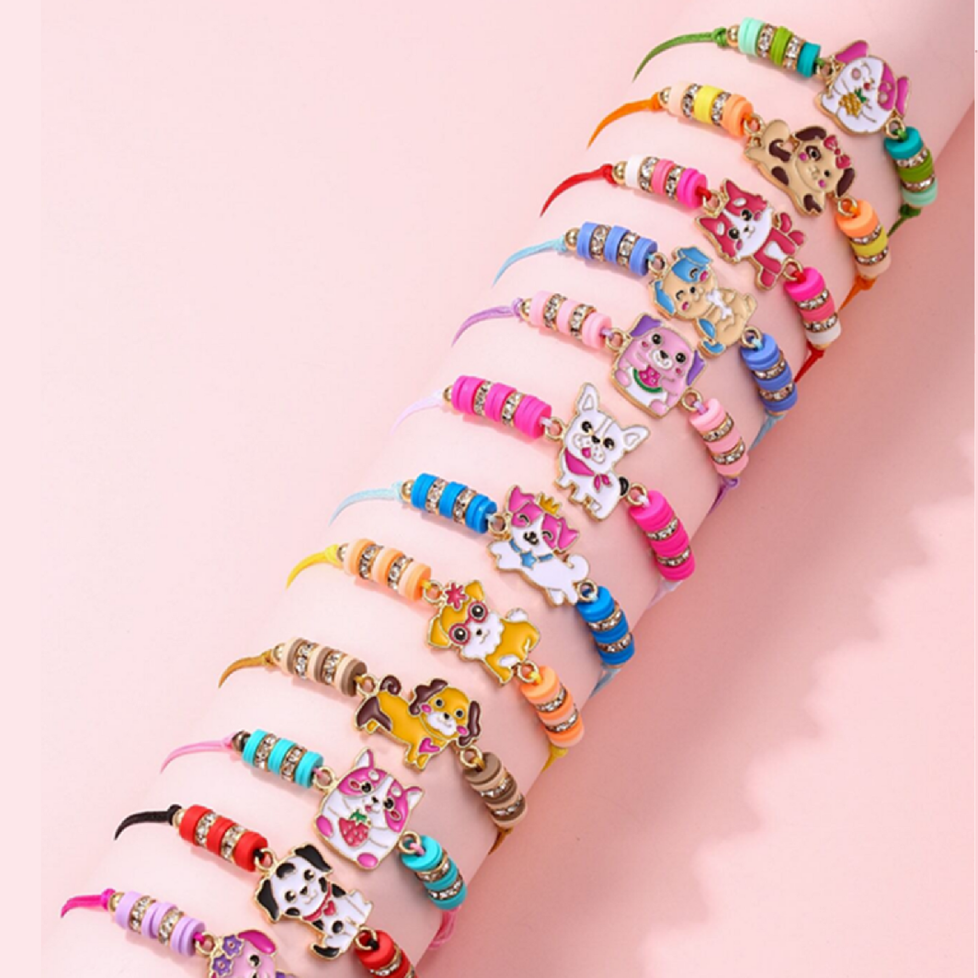 A collection of colorful braided bracelets with cat and dog charms, displayed on a cylindrical object.
