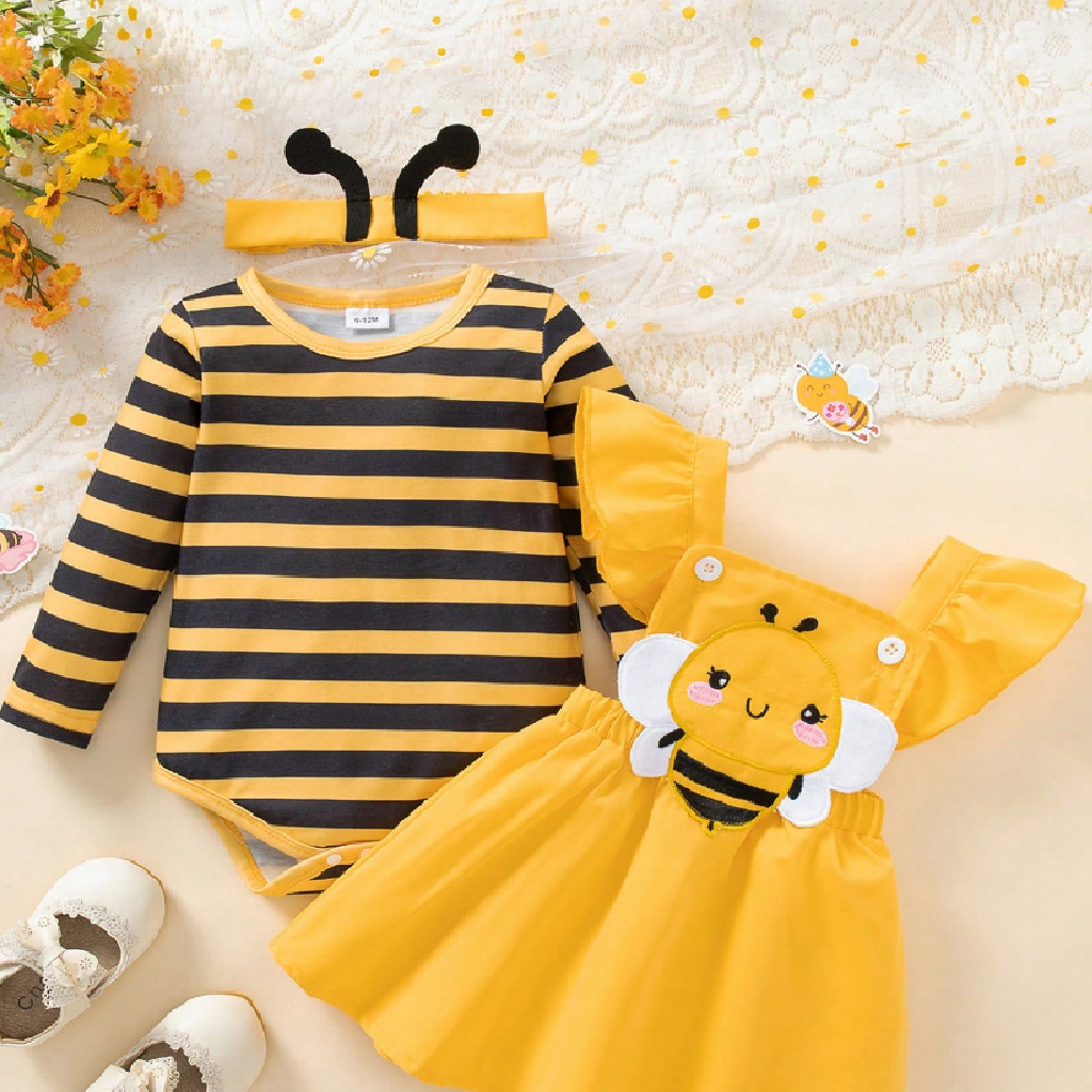 Bee-themed baby outfit with striped bodysuit and yellow dress on a light background.