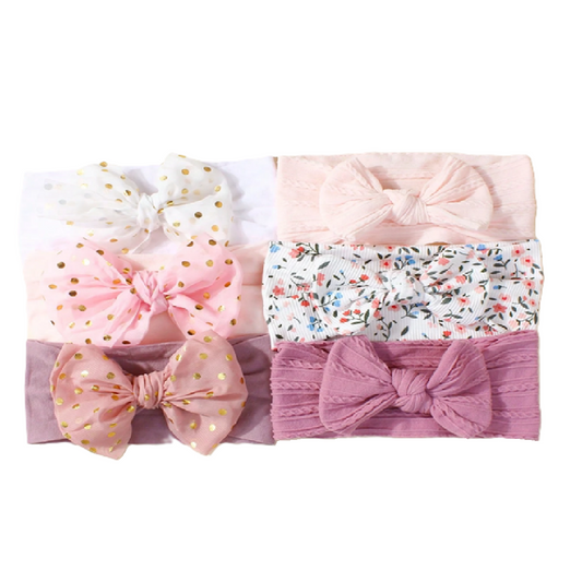 Set of four baby headbands with bow designs