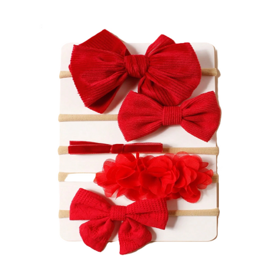 Set of red hair bows on a white background
