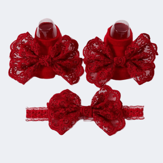 Red lace bow hair clips on a white background