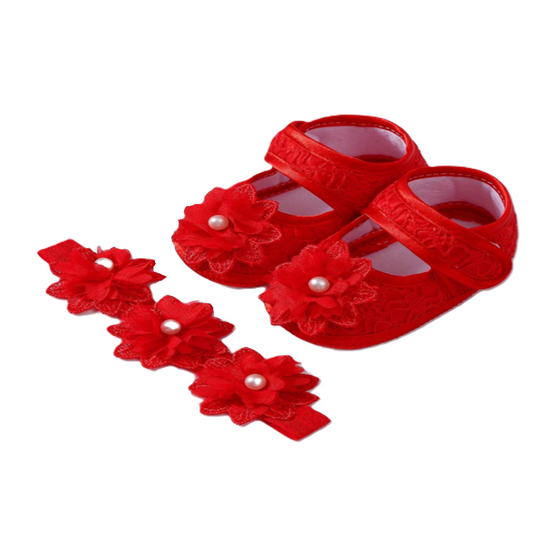Red baby shoes with floral designs