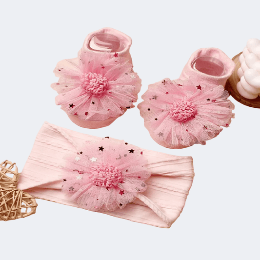 Pink baby booties and headband with floral details