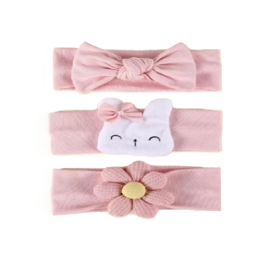 Set of three pink baby headbands with different designs on a white background