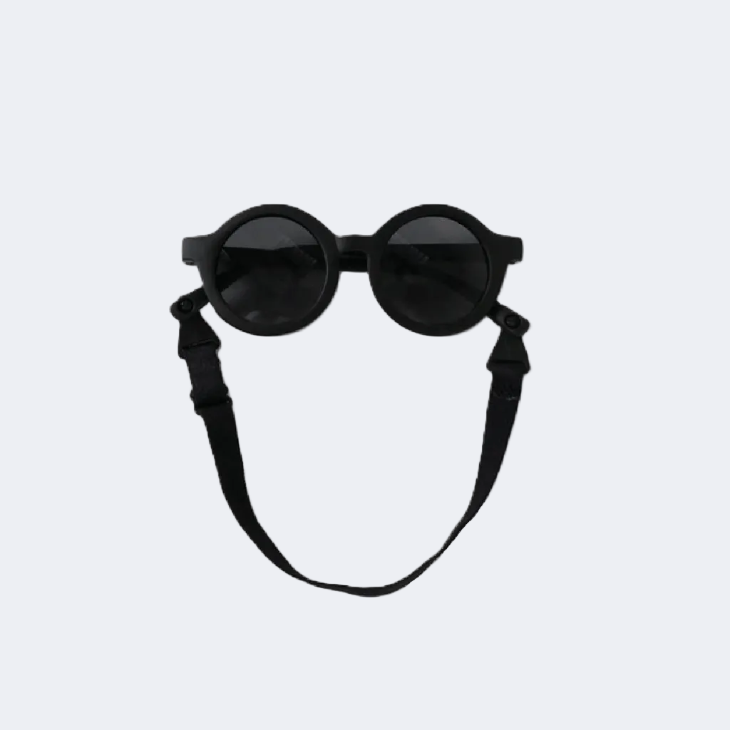 Black round sunglasses with a strap on a light gray background