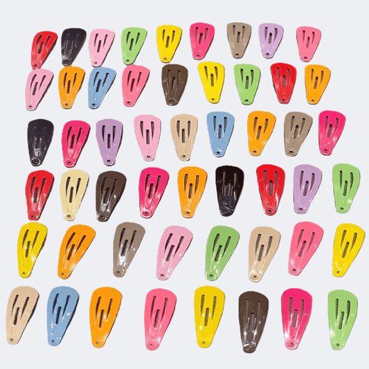 Colorful hair clips arranged in a grid on a white background