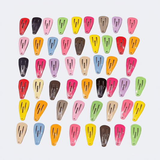 Colorful hair clips arranged in a grid on a light background