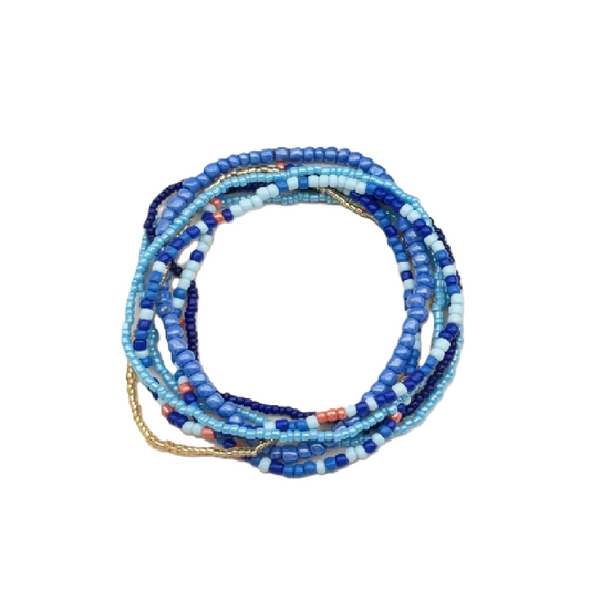 Set of blue and white beaded bracelets on a white background