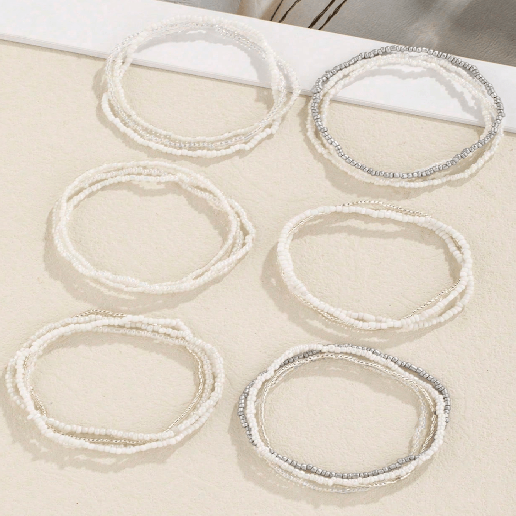 Set of six circular lace trims with measurements on a beige background