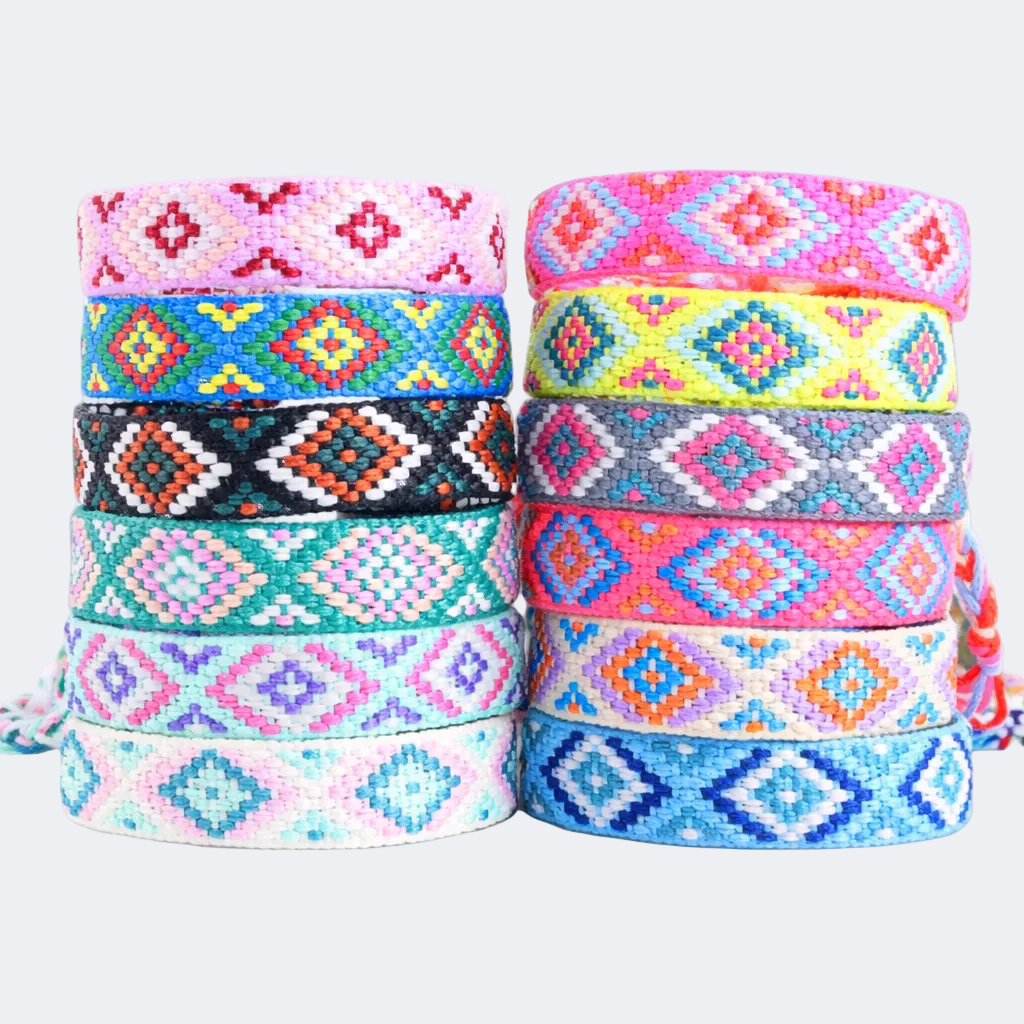 Stacks of colorful patterned bracelets on a white background
