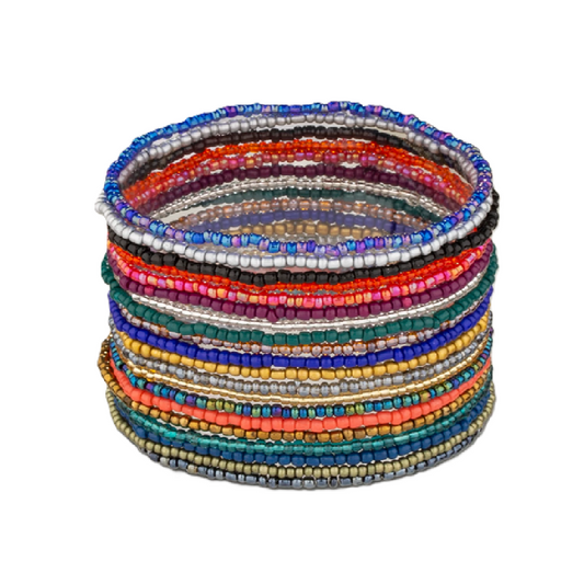Stack of colorful beaded bracelets on a white background