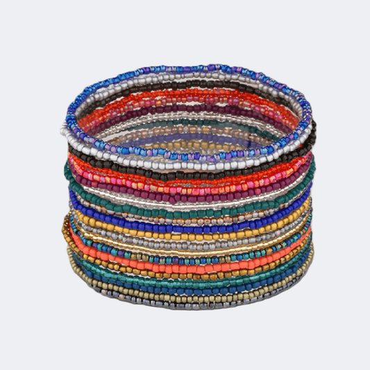 Stack of colorful beaded bracelets on a light gray background
