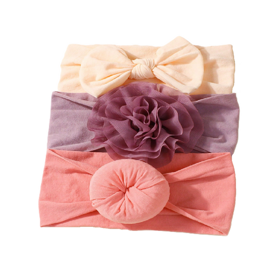 Set of three headbands with a bow, flower, and round design