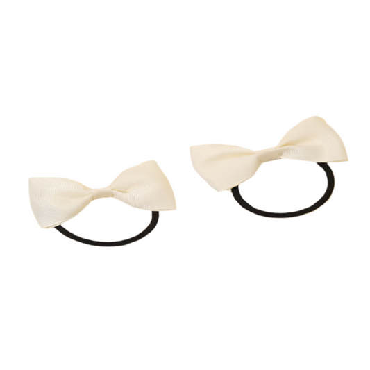 Two beige hair bows with black elastic bands on a white background