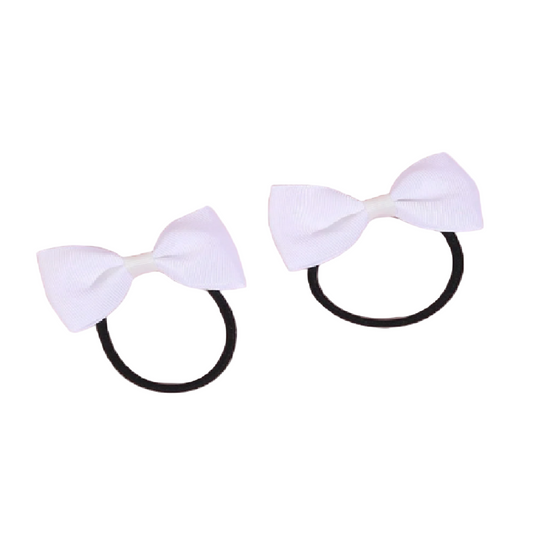 Two white hair bows on black elastic bands against a white background