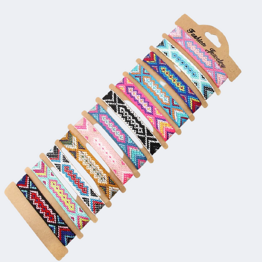 Set of colorful woven bracelets on a white background