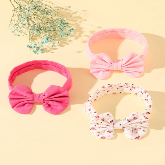 Three colorful headbands with bow designs
