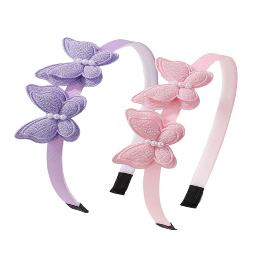 Two butterfly-shaped headbands, one purple and one pink