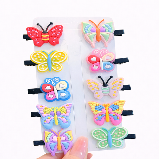 Colorful butterfly-shaped hair clips on a white background