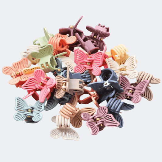 Colorful butterfly-shaped hair clips on a light gray background