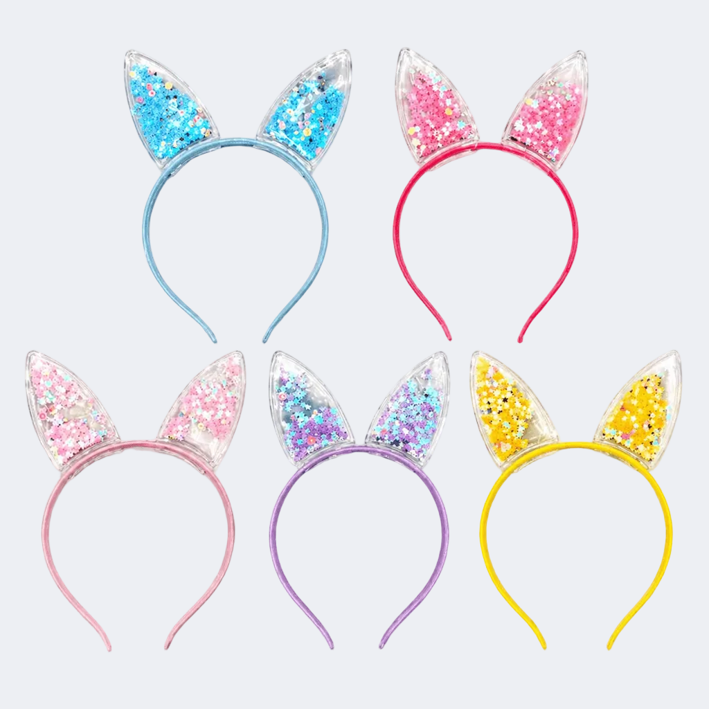 Set of colorful glittery cat ear headbands on a white background