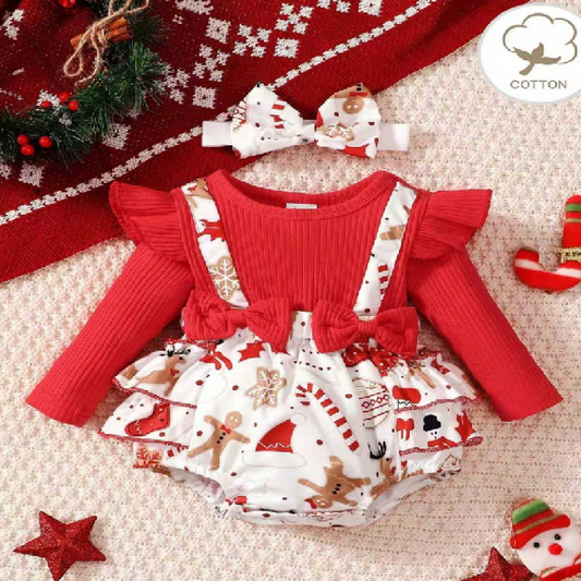 Christmas-themed baby romper with red top and patterned skirt, accompanied by a matching headband, on a textured surface.