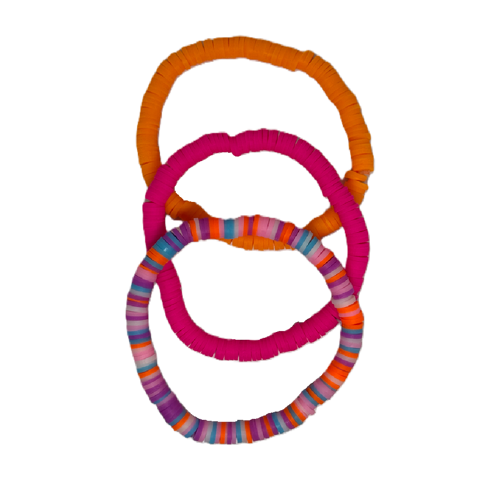 Colorful dog toys with striped patterns on a white background