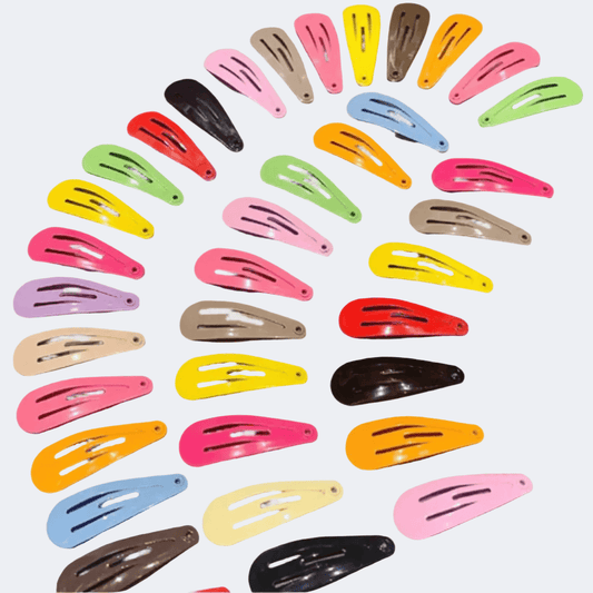 Assorted colorful hair clips arranged in a grid on a white background