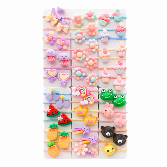 Set of colorful hair ties with various designs on a white background