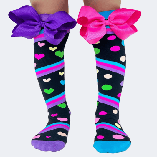 Knee-high socks with colorful bows on a white background