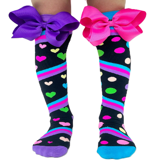 Knee-high socks with colorful bows on a white background
