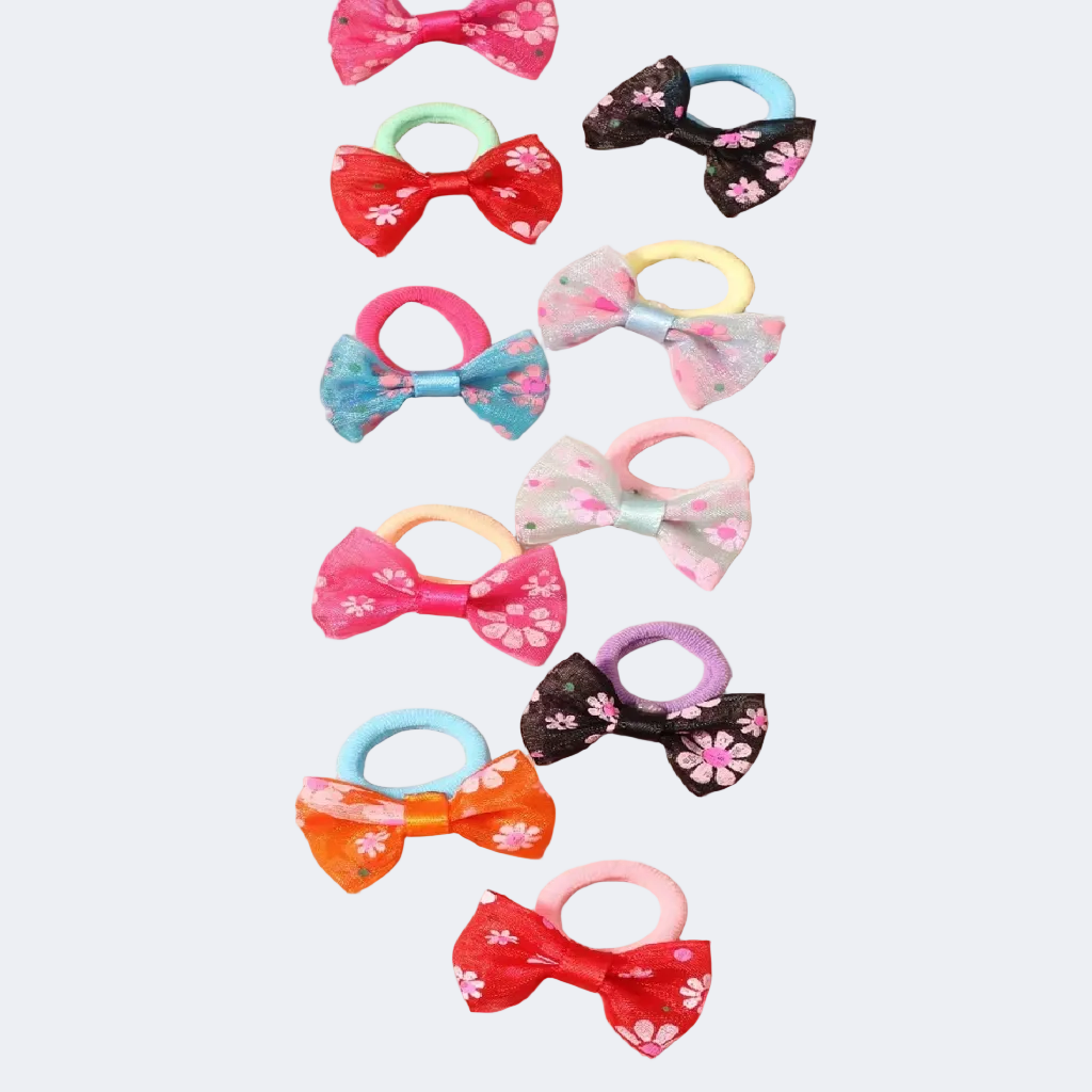 Colorful hair ties with floral designs on a beige surface