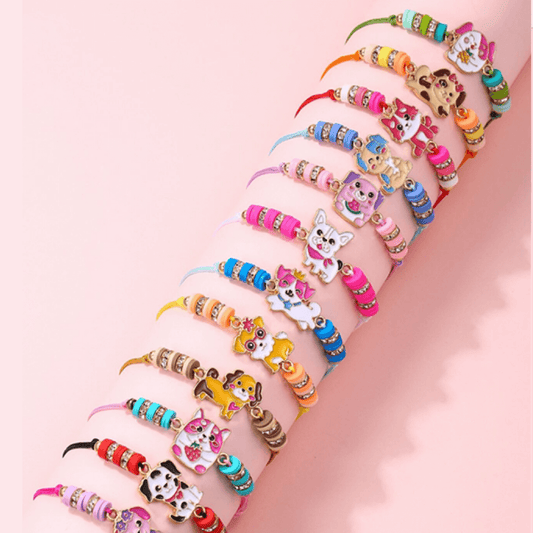 Colorful bracelets with animal charms on a pink background
