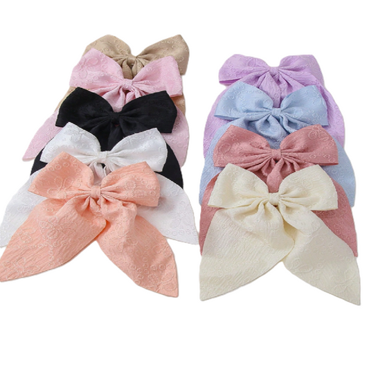 Set of colorful hair bows on a white background