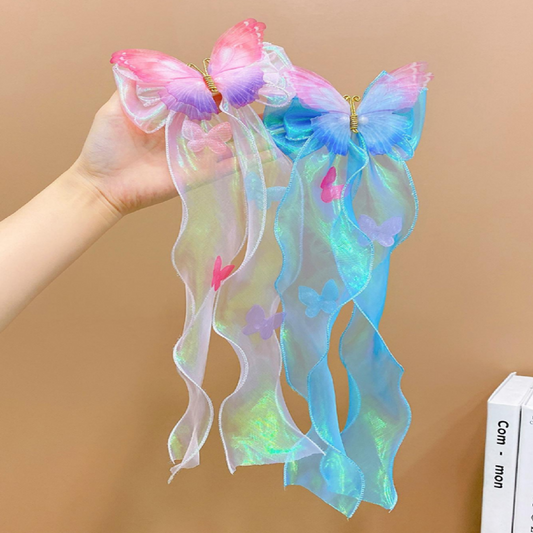 Colorful butterfly hair accessories held by a hand