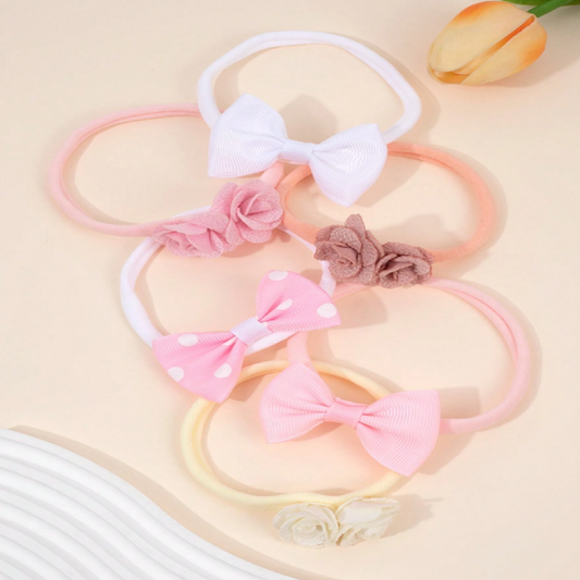 Set of pink hairbands with bows and flowers 
