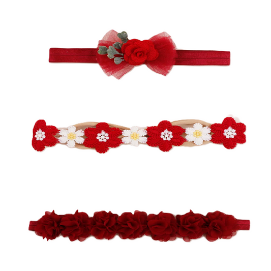 Set of three red headbands with floral designs 