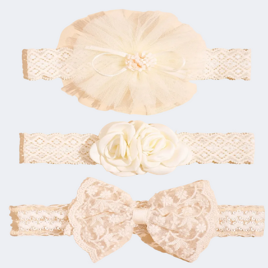Set of lace headbands with floral and bow designs on a beige background