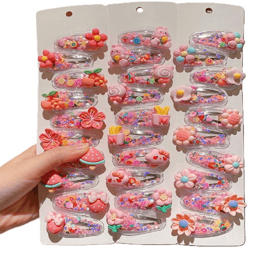 Assorted colorful hair clips on a display card held by a hand.