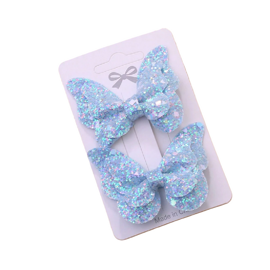 Three blue glittery hair bows