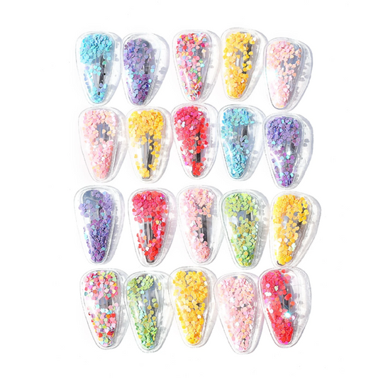 Set of colorful hair clips in clear cases