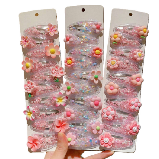 Set of pink floral hair accessories in packaging